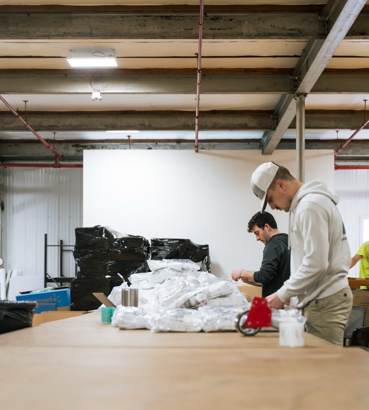 Ecom Accelerator team packing Poshmark orders