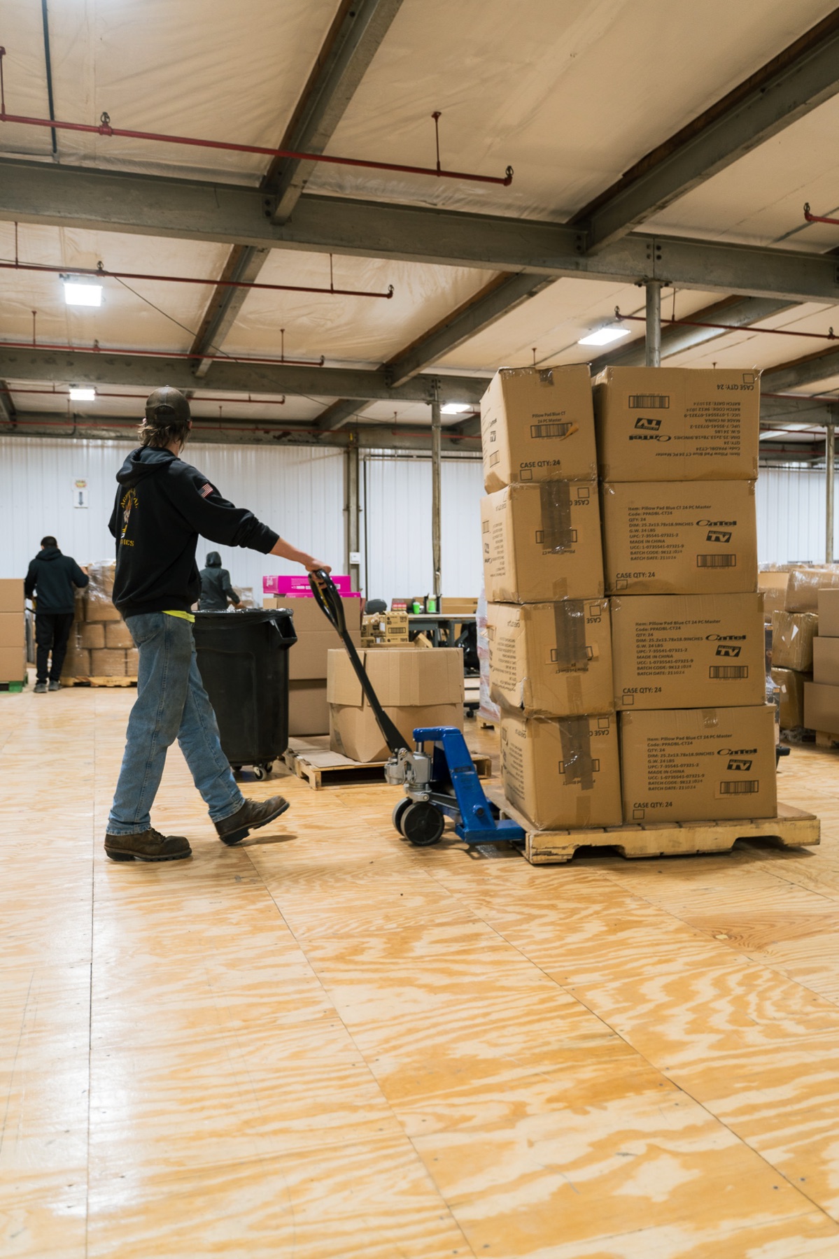 Team member moving a pallet of inventory